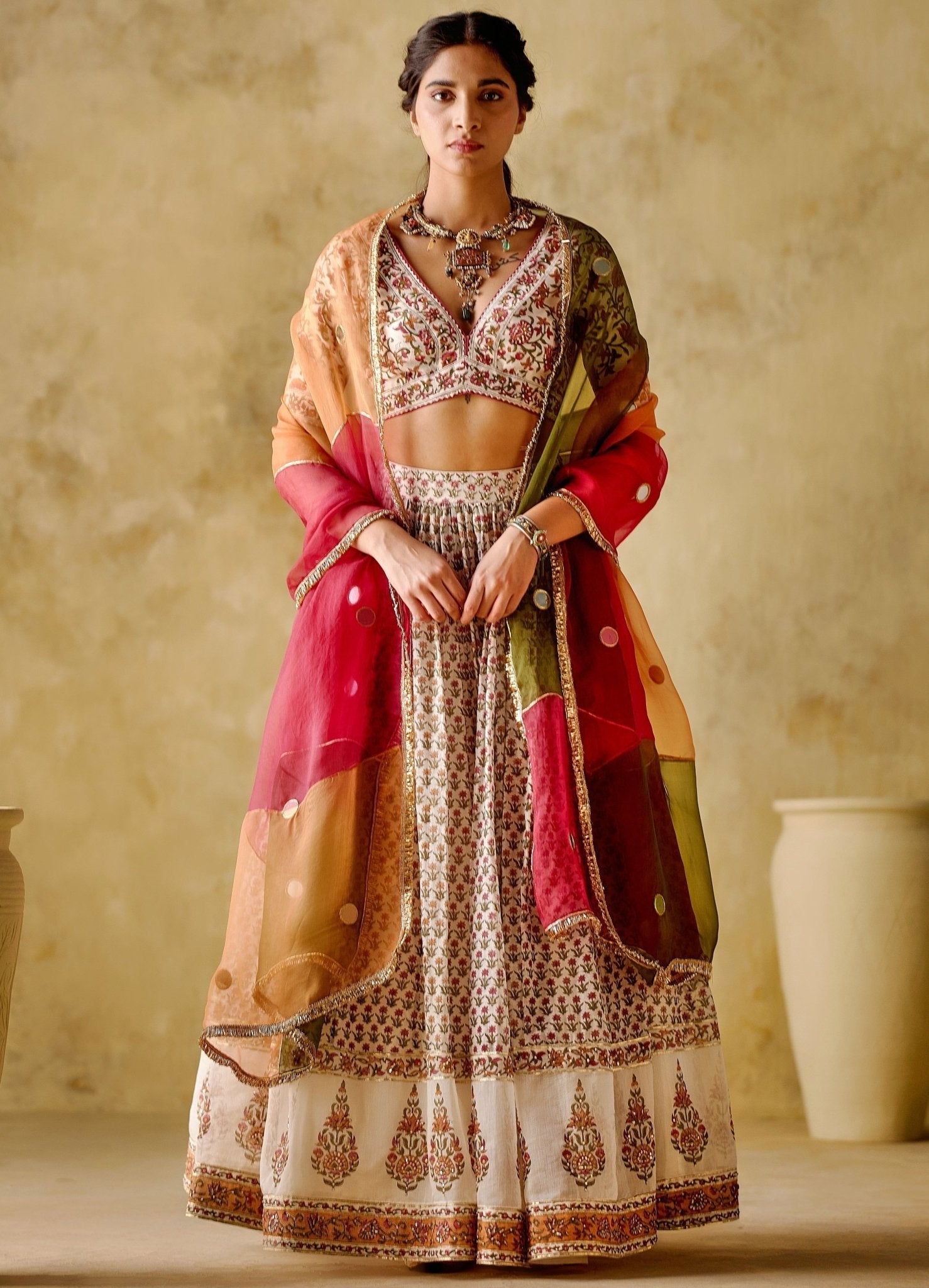 Orange brocade and floral lehenga with shops sequin dupatta