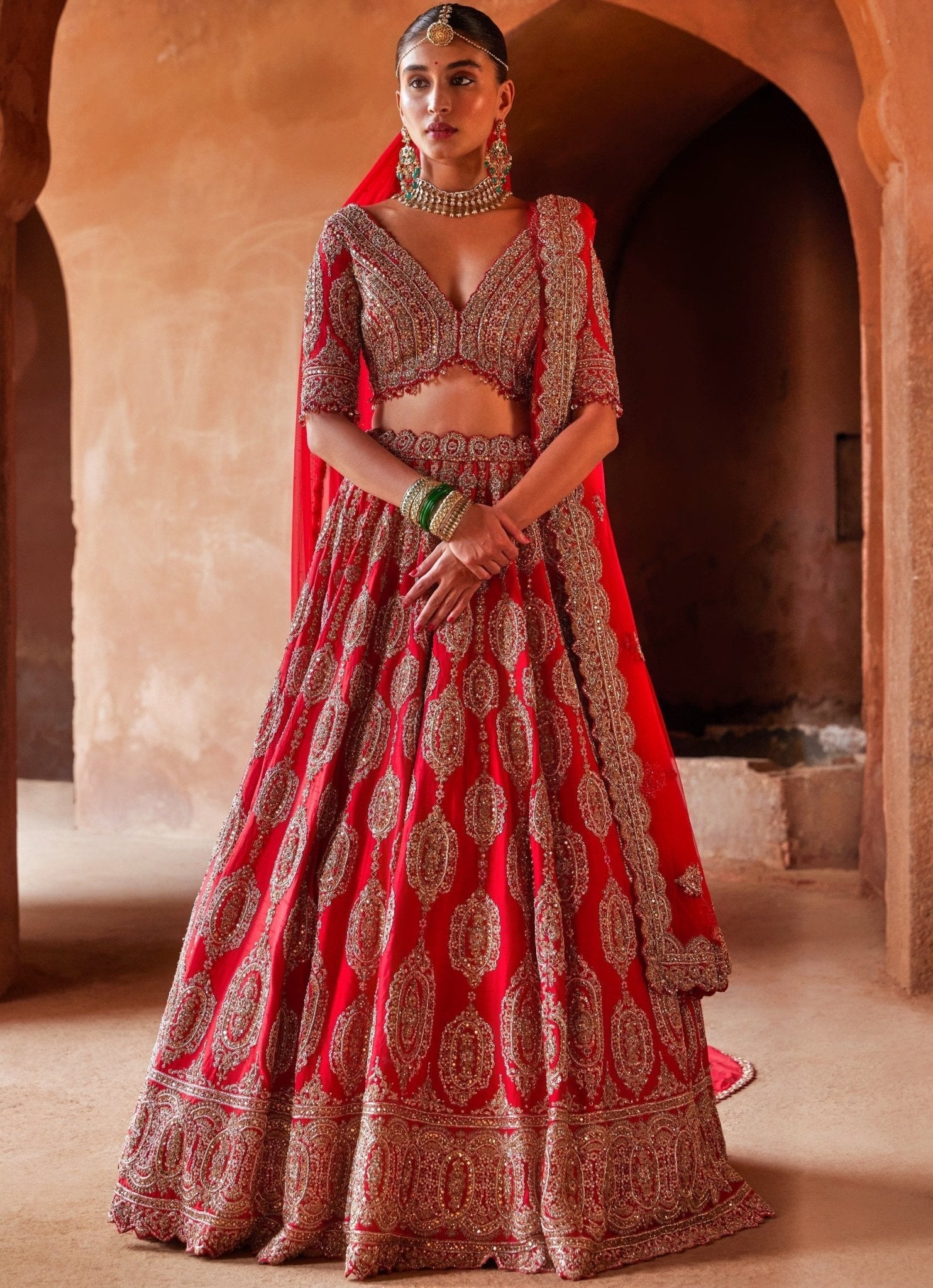 Bridal red lehenga shop with golden work