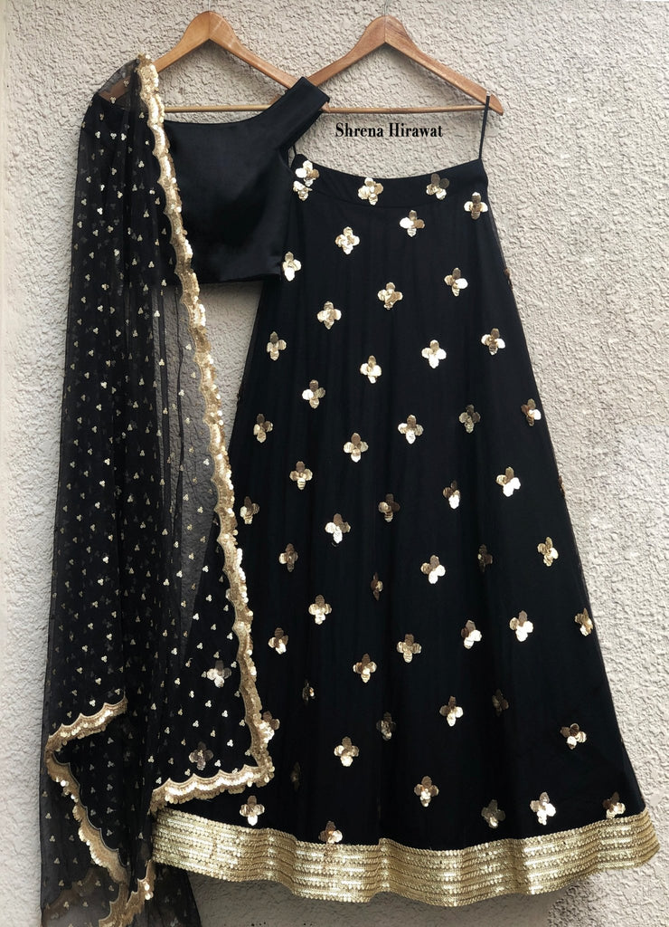 black and gold sequins lehenga with off shoulder satin blouse and scallop dupattalehengashrena hirawat