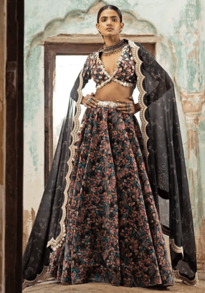 BLACK AND IVORY PRINTED LEHENGA SET AND A ZARI EMBROIDERED BLOUSE PAIRED  WITH A BLACK AND IVORY PRINTED DUPATTA WITH A SILVER EMBROIDERED BORDER AND  BUTIS. - Seasons India