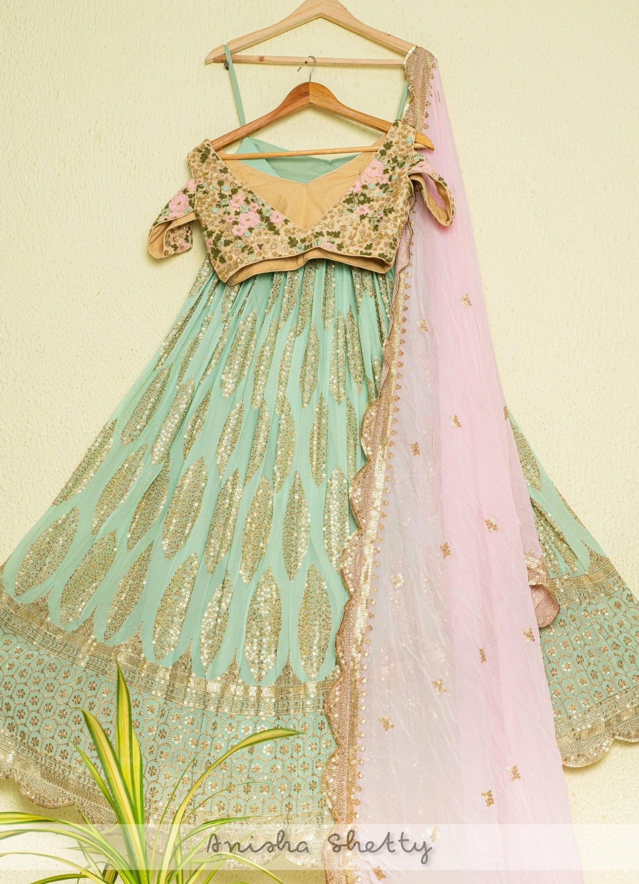 https://www.fabiliciousfashion.com/cdn/shop/products/mint-shimmer-lehenga-with-oyster-floral-blouse-and-pink-dupattalehengafabilicious-fashion-818468_1800x1800.jpg?v=1695667713