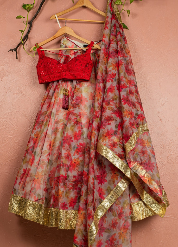 red printed lehenga with red embroidered blouse and printed dupattalehengaanisha shetty